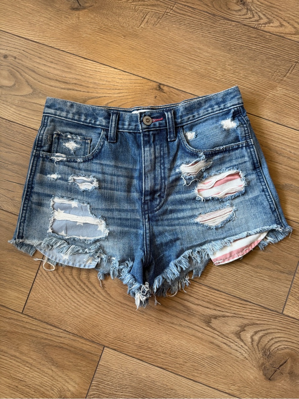 Hollister Ripped High-Rise Denim Shorts in Blue with flag pockets